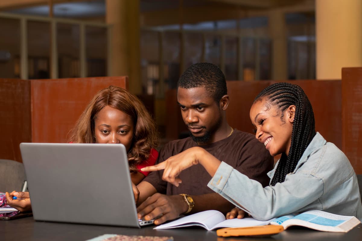 African students studying together with laptops
